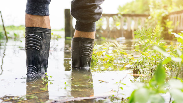 Men wear black boots for a flood.