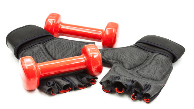 Red color dumbbells and gloves isolated on white, firness and exercise concept