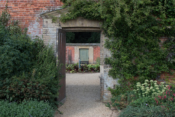 Fototapeta na wymiar Doorway in a walled garden