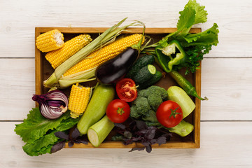 Plenty of fresh vegetables on wooden background with copy space