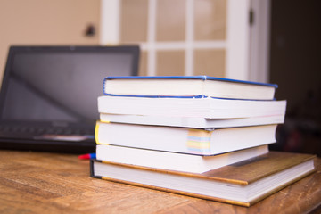 Working desk.Open laptop, books office