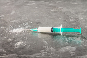 Sugar in a syringe. Conceptual depiction of dependence on the sweet. Sugar is a drug. Injection of...