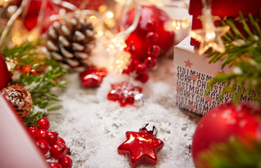 Gift boxes and colorful decorated Christmas tree on white bokeh background