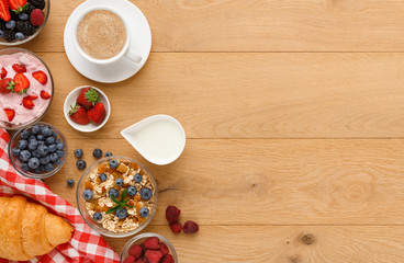 Rich breakfast on natural wooden table