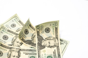 Stack of twenty dollar bills on white background.