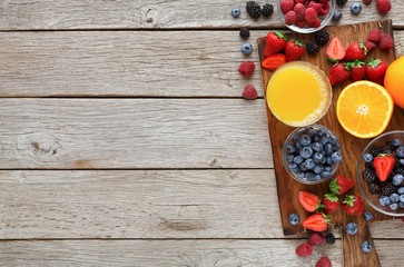 Tasty pastry, fruits and berries on rustic wood, top view