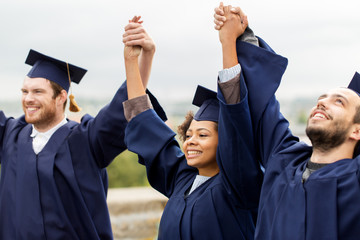 happy students celebrating graduation