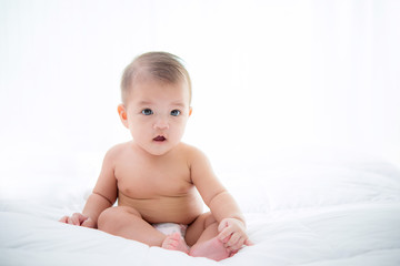 baby laying wearing diaper