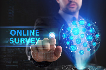 The concept of business, technology, the Internet and the network. A young entrepreneur working on a virtual screen of the future and sees the inscription: Online survey