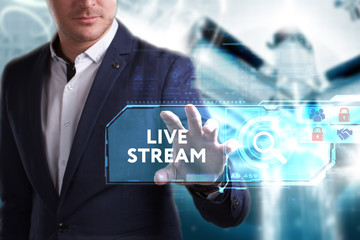Business, Technology, Internet and network concept. Young businessman working on a virtual screen of the future and sees the inscription: Live stream