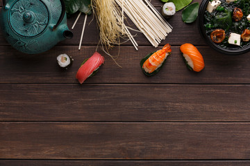 Asian food on wooden background, copy space
