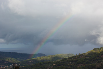 Rainbow over Soller Valley surrounded by the Serra de Tramuntana mountains. Majorca, Spain