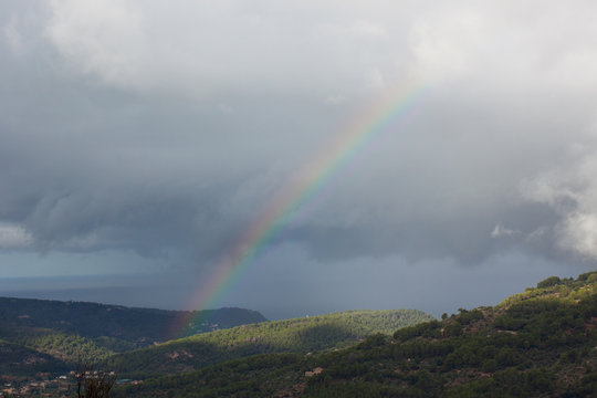 Rainbow over Soller Valley surrounded by the Serra de Tramuntana mountains. Majorca, Spain © Jeanne Emmel