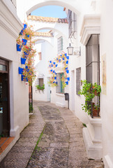 Poble Espanyol street, with traditional for Andalusia white walls, Barcelona, Catalonia Spain