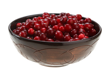 cranberries in a clay bowl isolated on white background