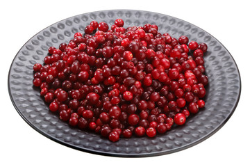cranberry on black plate isolated on white background