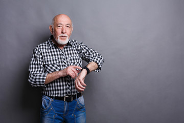 Senior man using his new smart watch