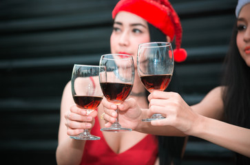 Group of Friends Enjoying Cheerful Party and Clinking Glass of Wine at Rooftop Nightclub