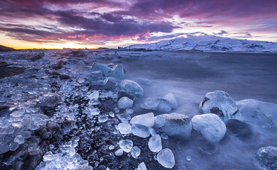 Icebergs in Jokulsarlon glacial lake during sunset, Iceland