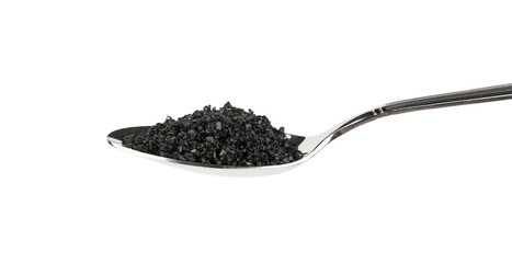 Close up metal spoon of black Hawaiian salt