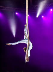 Young woman circus air gymnast
