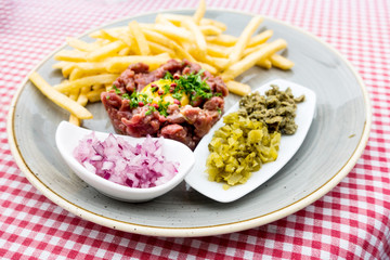 tasty Steak tartare (Raw beef) - classic steak tartare on white plate
