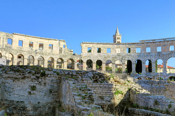 Fototapeta premium Ancient Roman Amphitheater and Church Bell Tower in Pula, Istria, Croatia, Europe
