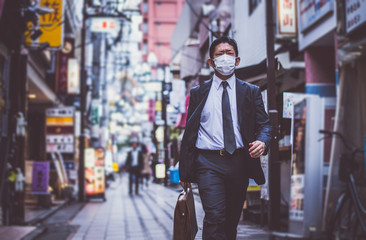 Senior business man moments on the streets of Tokyo