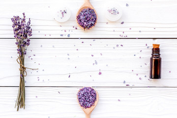 Aromatherapy for relax concept. Lavender branch, spa salt, oil and candles on white background top view copyspace