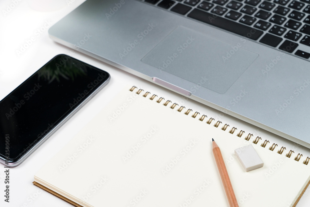 Poster Business office work desk table with computer laptop , note and stationery on white table background include copyspace for add text or graphic