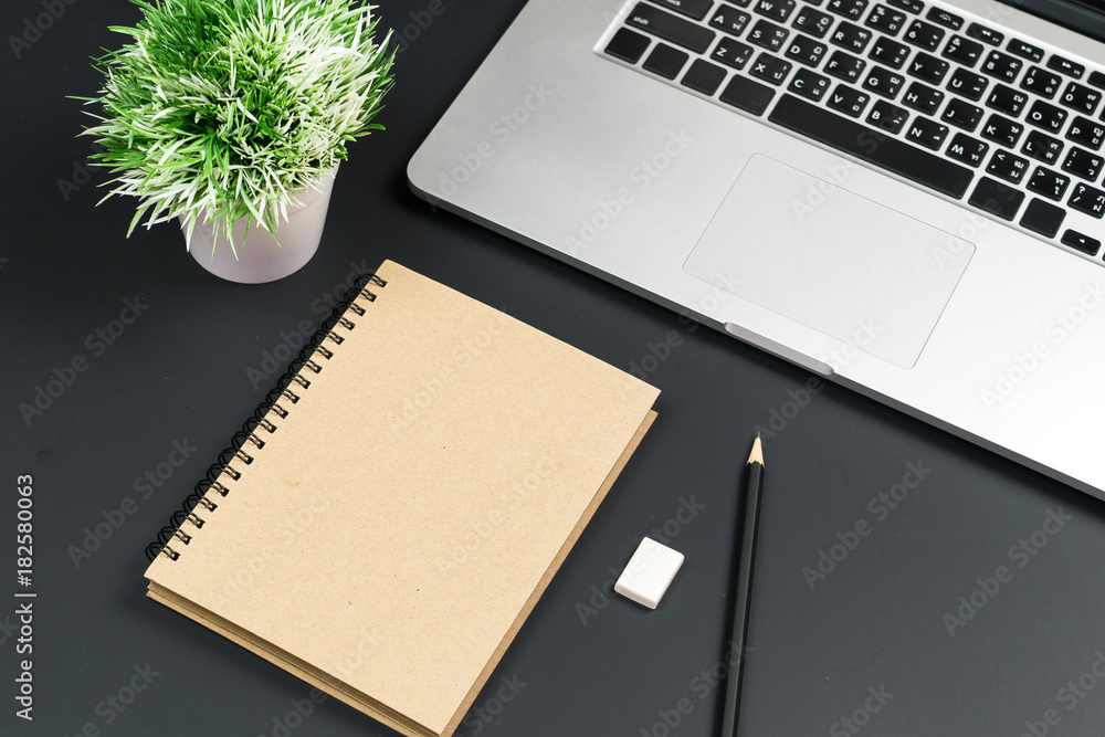 Poster Business office work desk table with computer laptop , note and stationery on black table background include copyspace for add text or graphic