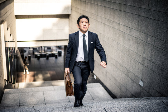 Senior business man moments on the streets of Tokyo