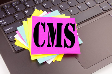 Writing CMS text made in the office close-up on laptop computer keyboard. Business concept for CMS...