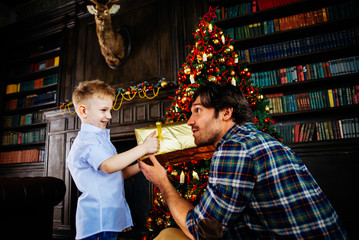 Family home portrait. Parents and son spending time together