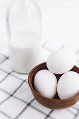White background with milk and eggs