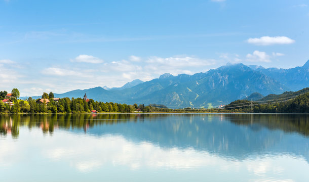 Green water Weissensee lake in Alps Mountains