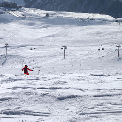 Snowboarder downhill on freeride trace