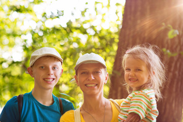 mother with two children in nature.