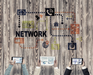 Top view of businesspeople sitting at table and using gadgets