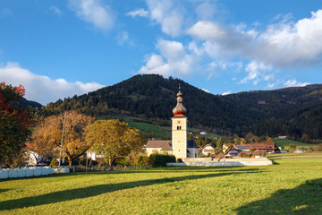 St. John Church in the fall. Alpine village Obermillstatt, Gurktal Alps (Nock Mountains), state of Carinthia, Austria.