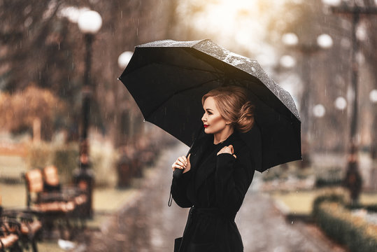 Woman With Umbrella In The Rain