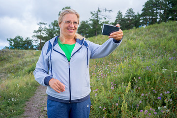 Elderly woman doing sport outside