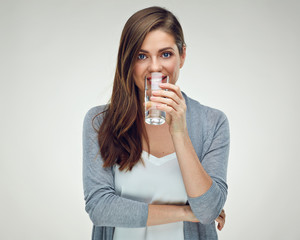 Isolated studio portrait of girl with water glass.