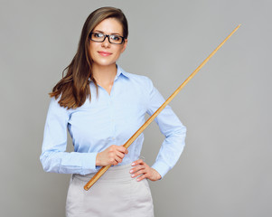 Teacher woman standing with pointer against gray