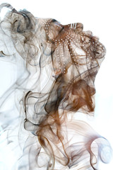 Double exposure of a dark skinned man with dreadlocks and closed eyes combined with a photograph of...