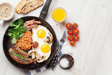 English breakfast. Fried eggs, sausages, bacon