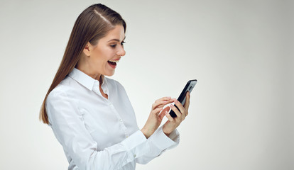 Smiling happy businesswoman using smart phone.