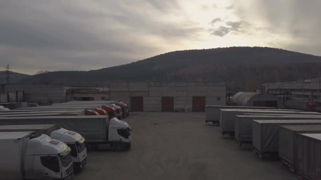 Truck with freight container driving out from parked plase after unloading