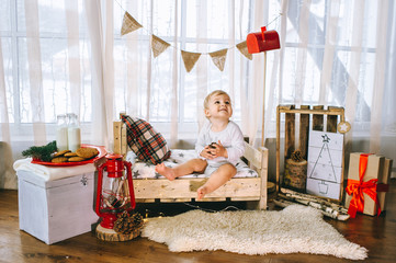 little boy eating biscuits with milk