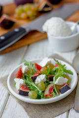 Vegetarian salad with figs and goar cheese.